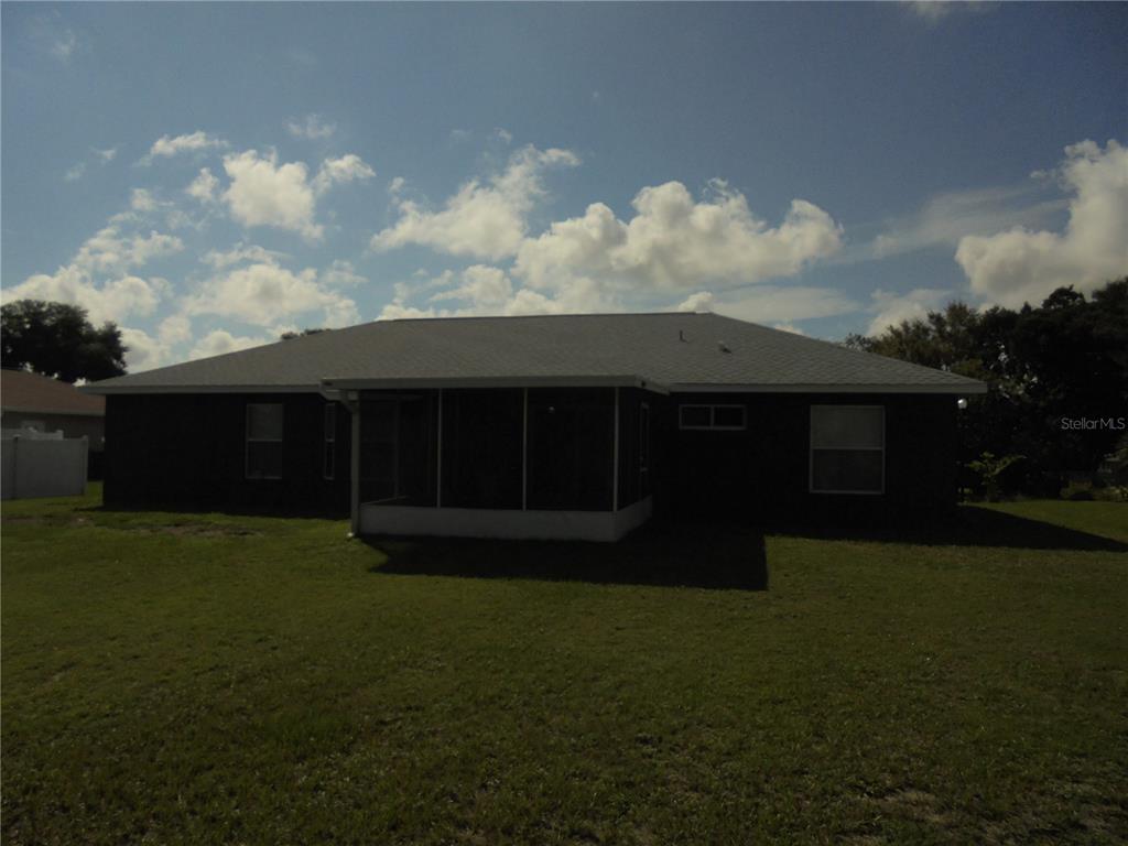 1509 Northeast 46th Road Ocala, FL 34470 - Photo 5 of 28 a view of house with backyard space