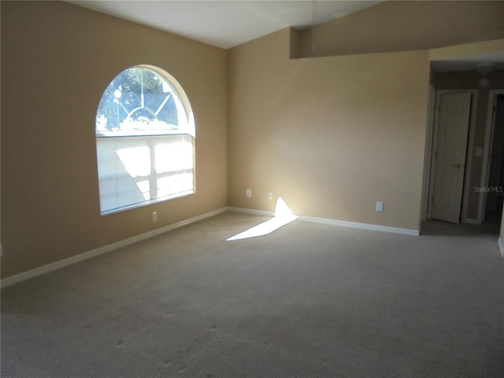1509 Northeast 46th Road Ocala, FL 34470 - Photo 10 of 28 an empty room with a window