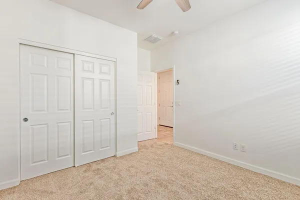 an empty room with closet area