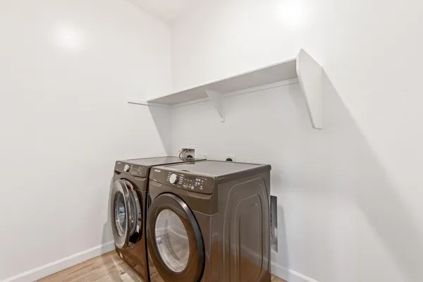 a utility room with dryer and washer