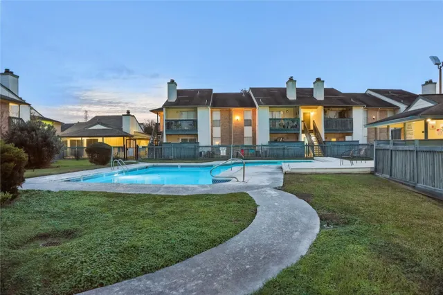 a view of a house with swimming pool