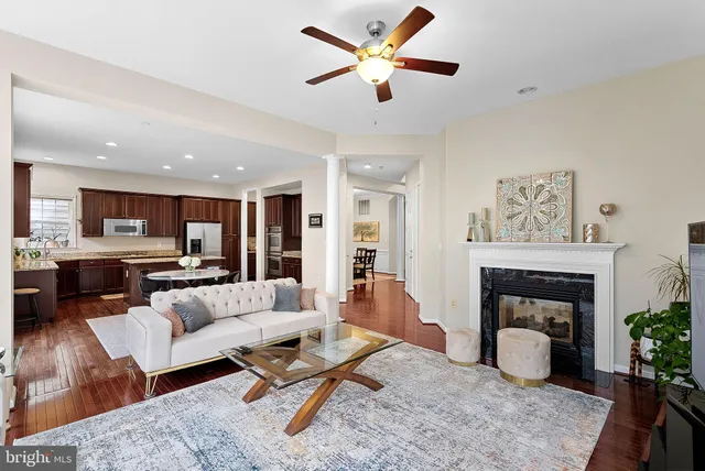 a bathroom with a sink a toilet a mirror a bathtub and shower