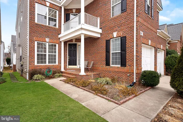 a view of entryway with wooden floor and stairs