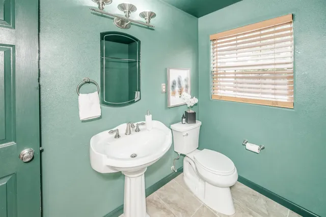 a bathroom with a sink and a toilet