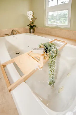 a bathroom with a glass door shower