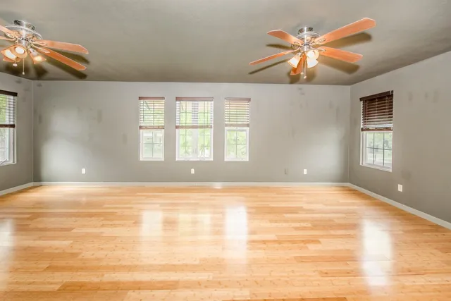 a view of a livingroom with a chandelier fan