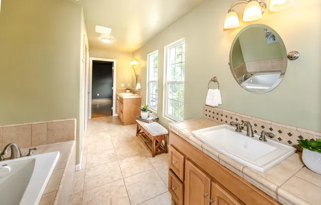 a view of a yard with wooden fence