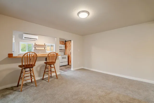 a view of a livingroom with furniture and windows