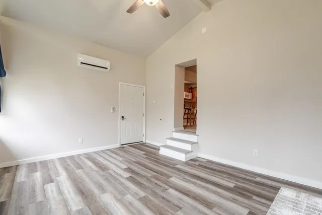 a view of an empty room with a window