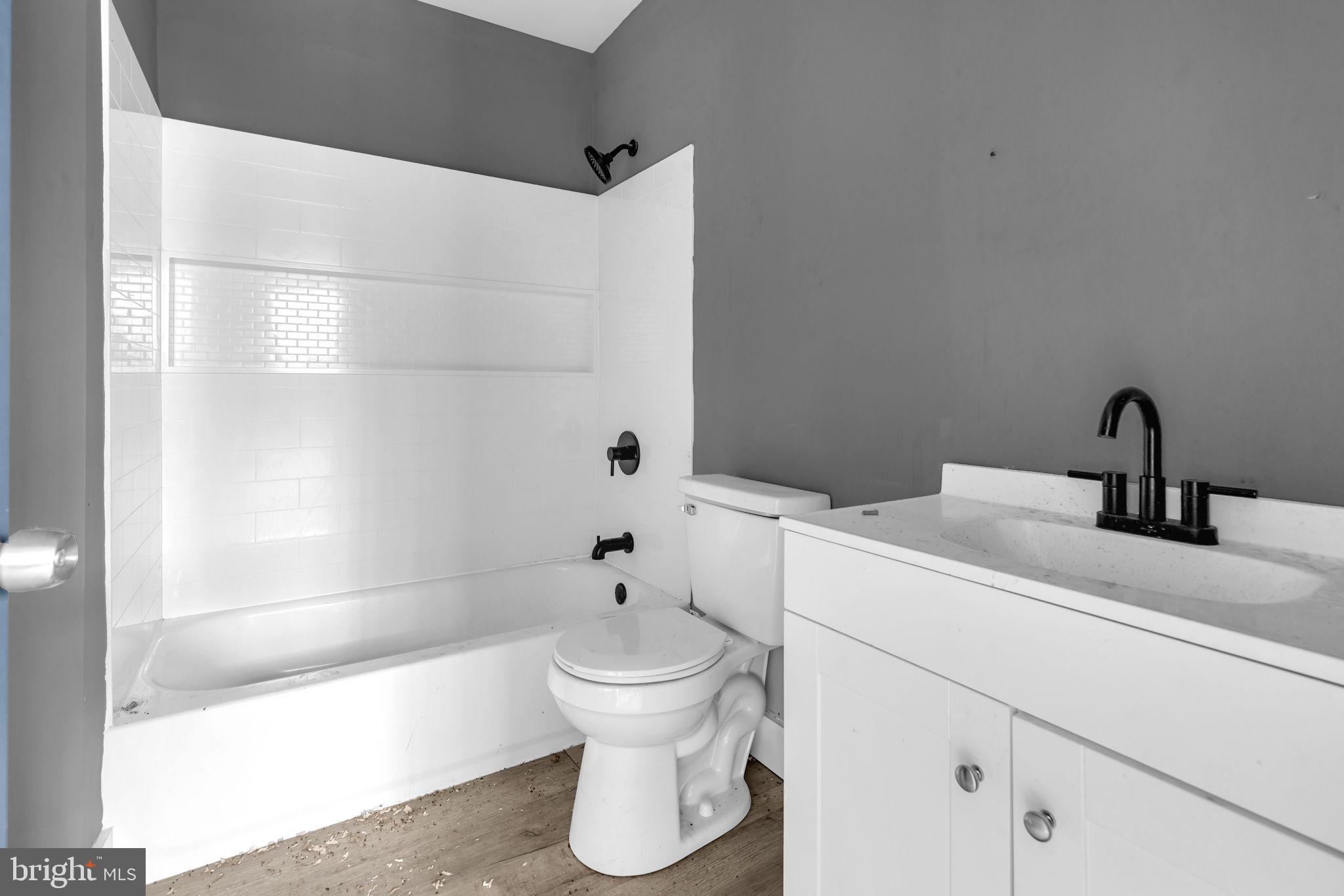 2315 East Madison Street Baltimore, MD 21205 - Photo 11 of 18 a bathroom with a sink and a toilet