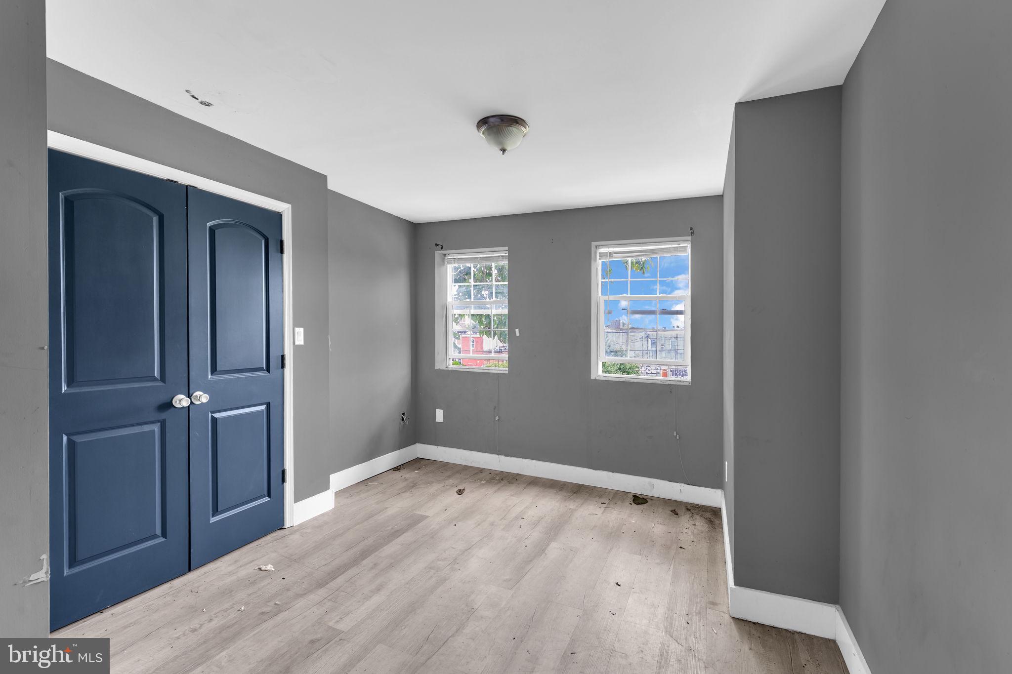 2315 East Madison Street Baltimore, MD 21205 - Photo 12 of 18 a view of wooden floor and windows in a room