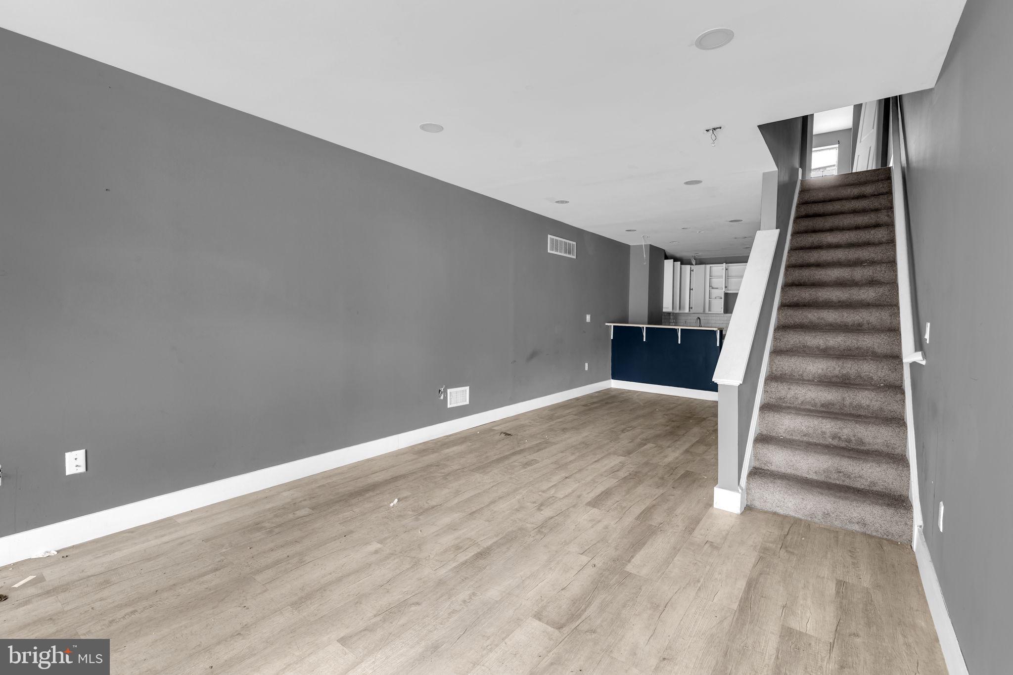 2315 East Madison Street Baltimore, MD 21205 - Photo 6 of 18 a view of entryway and hall with wooden floor