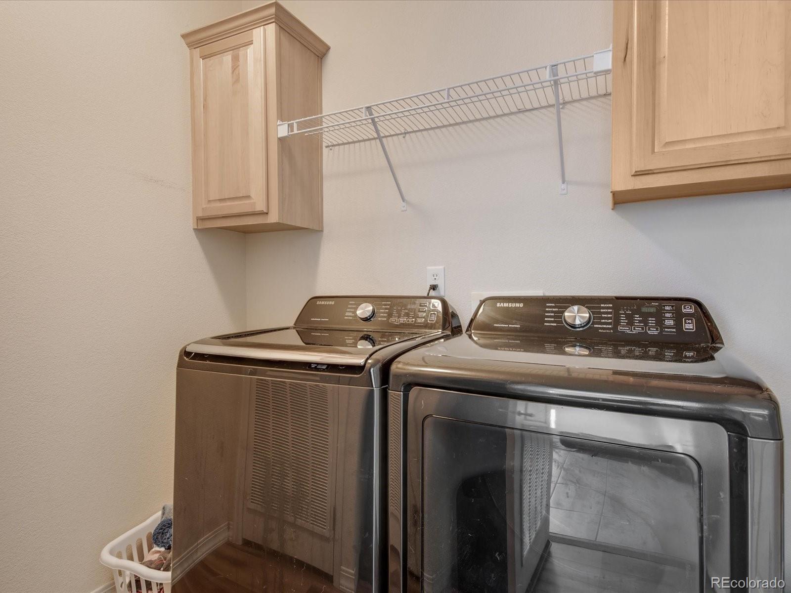 7775 Sage Green Frederick, CO 80530 - Photo 17 of 40 a utility room with dryer and washer
