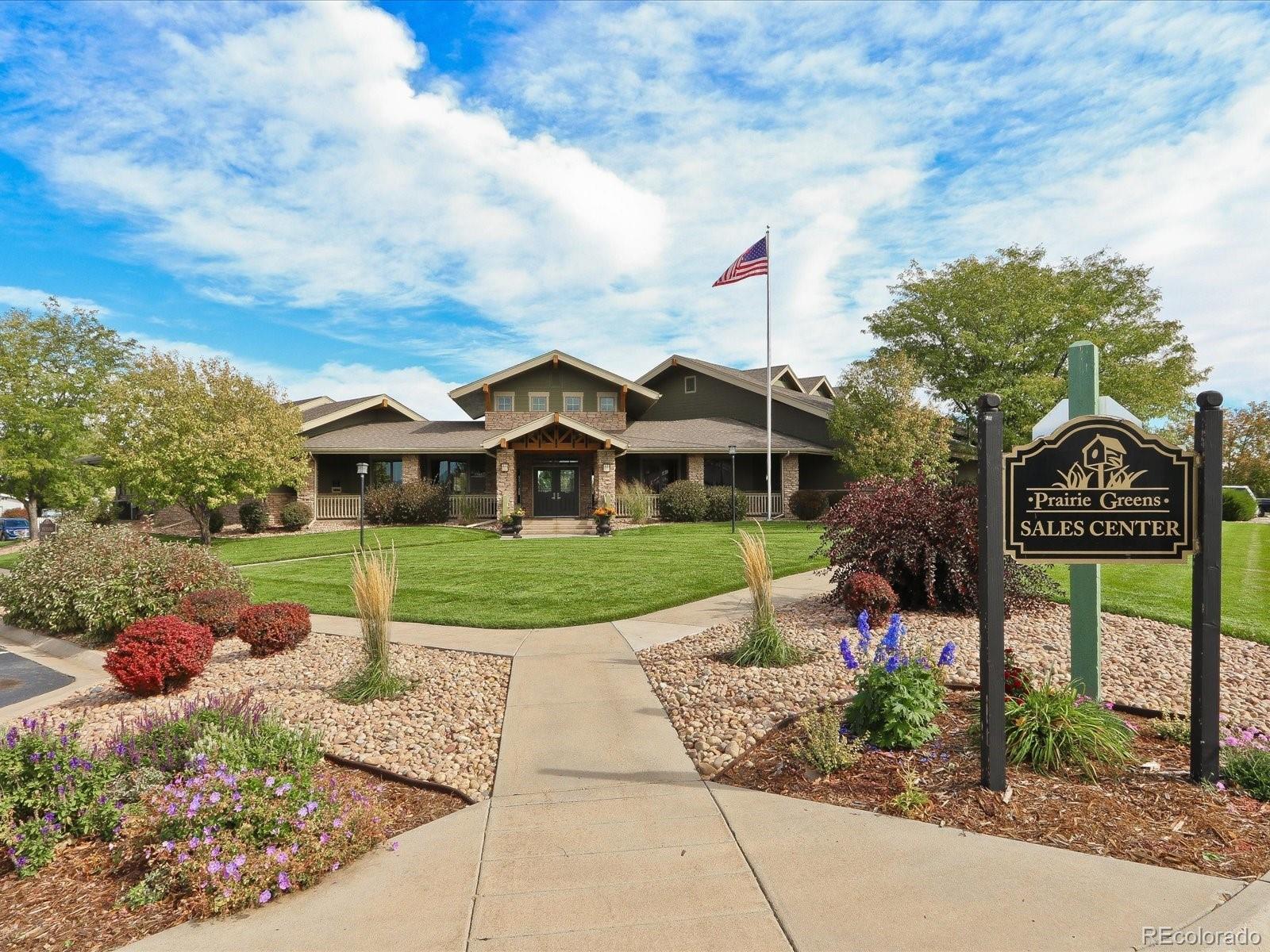 7775 Sage Green Frederick, CO 80530 - Photo 24 of 40 a front view of a house with garden