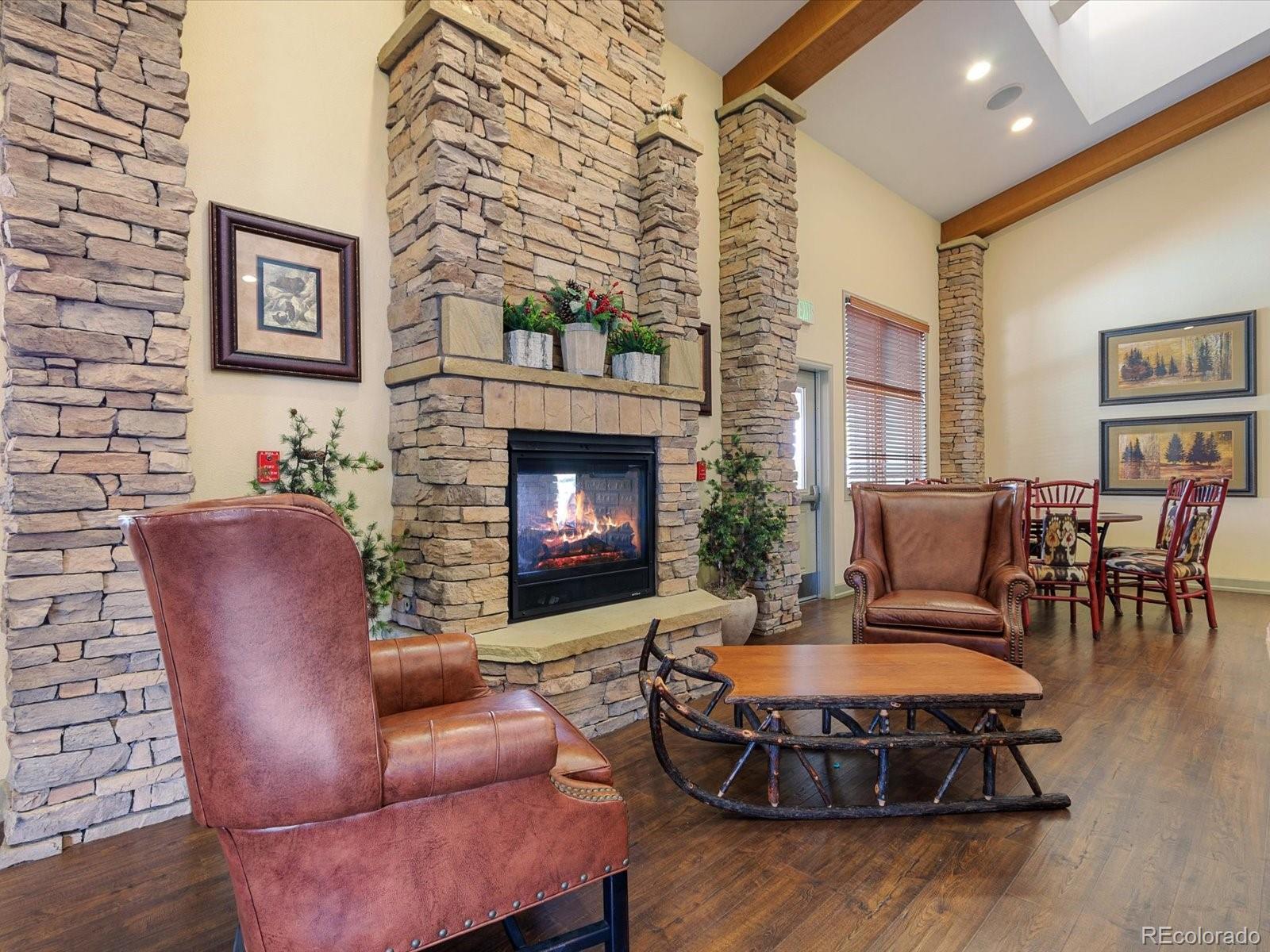7775 Sage Green Frederick, CO 80530 - Photo 28 of 40 a living room with furniture and a fireplace