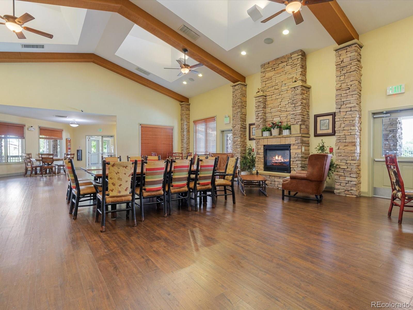 7775 Sage Green Frederick, CO 80530 - Photo 29 of 40 a group of people sitting at tables in a room