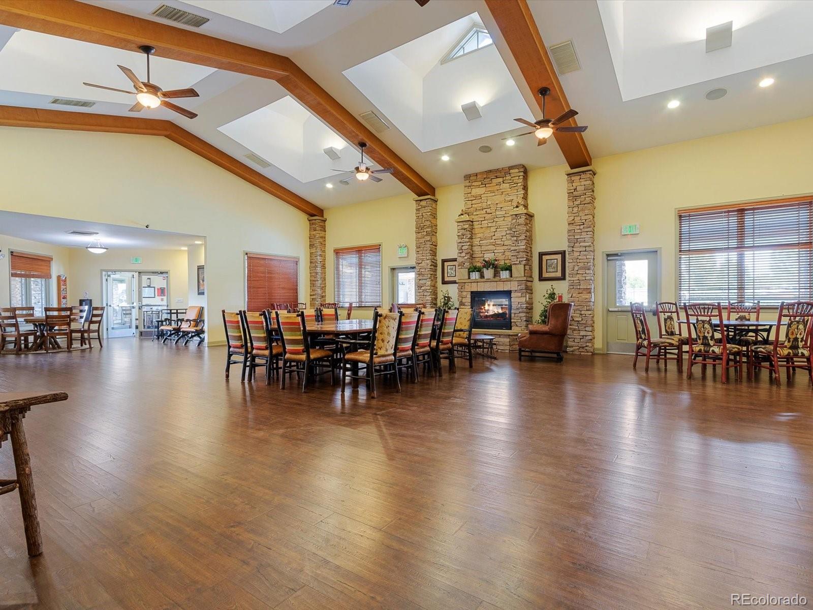 7775 Sage Green Frederick, CO 80530 - Photo 30 of 40 a view of a dining room with furniture and wooden floor