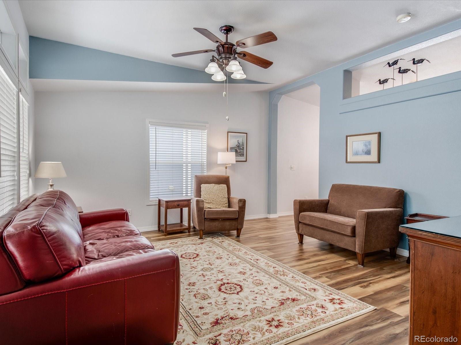 7775 Sage Green Frederick, CO 80530 - Photo 3 of 40 a living room with furniture and a chandelier