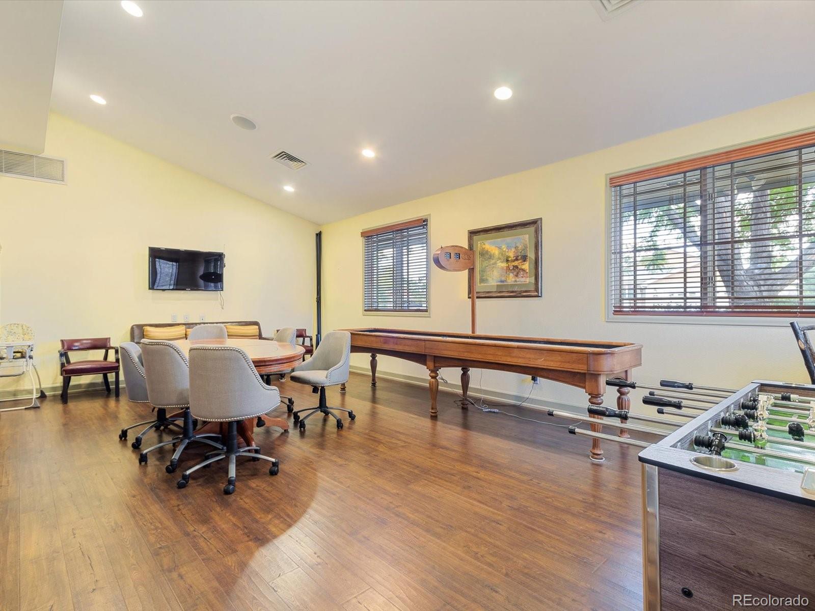 7775 Sage Green Frederick, CO 80530 - Photo 32 of 40 a living room with furniture a window and work place