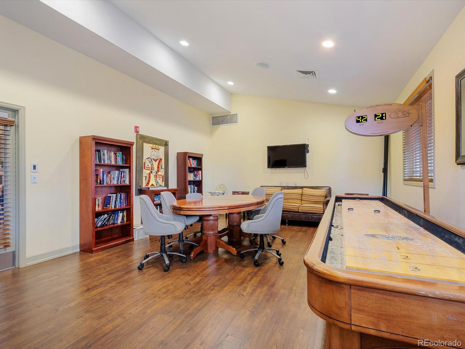 7775 Sage Green Frederick, CO 80530 - Photo 33 of 40 a view of a workspace with furniture and wooden floor
