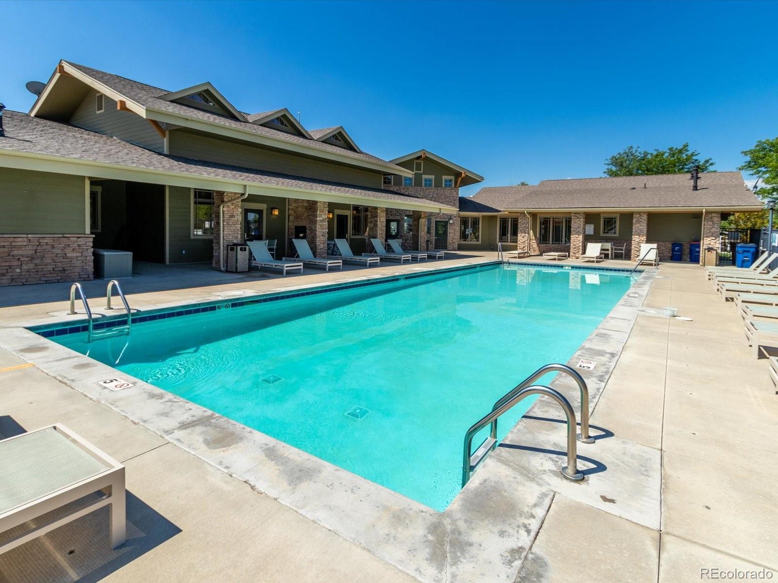 7775 Sage Green Frederick, CO 80530 - Photo 40 of 40 a view of house with swimming pool and yard