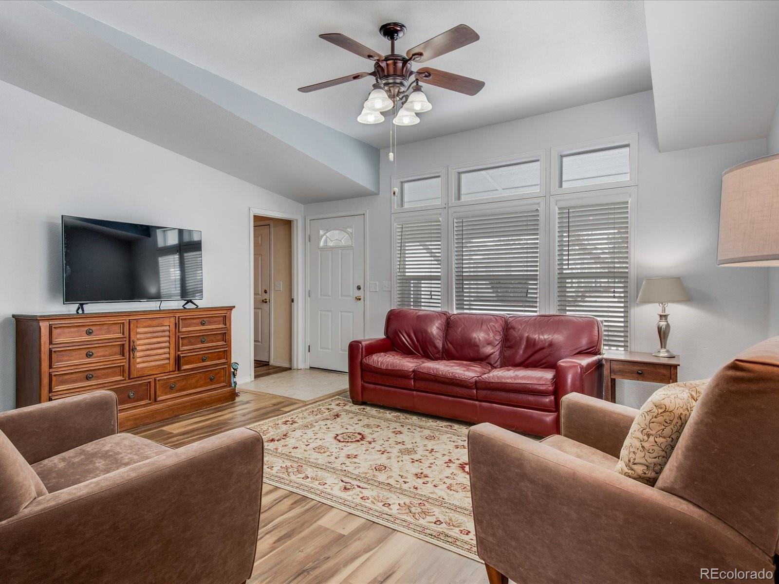 7775 Sage Green Frederick, CO 80530 - Photo 4 of 40 a living room with furniture and a flat screen tv