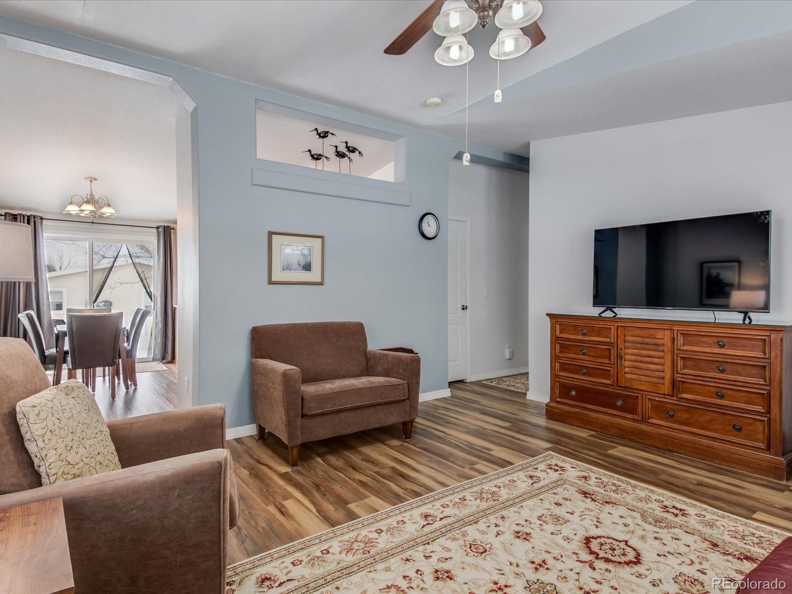 7775 Sage Green Frederick, CO 80530 - Photo 6 of 40 a living room with furniture and a flat screen tv