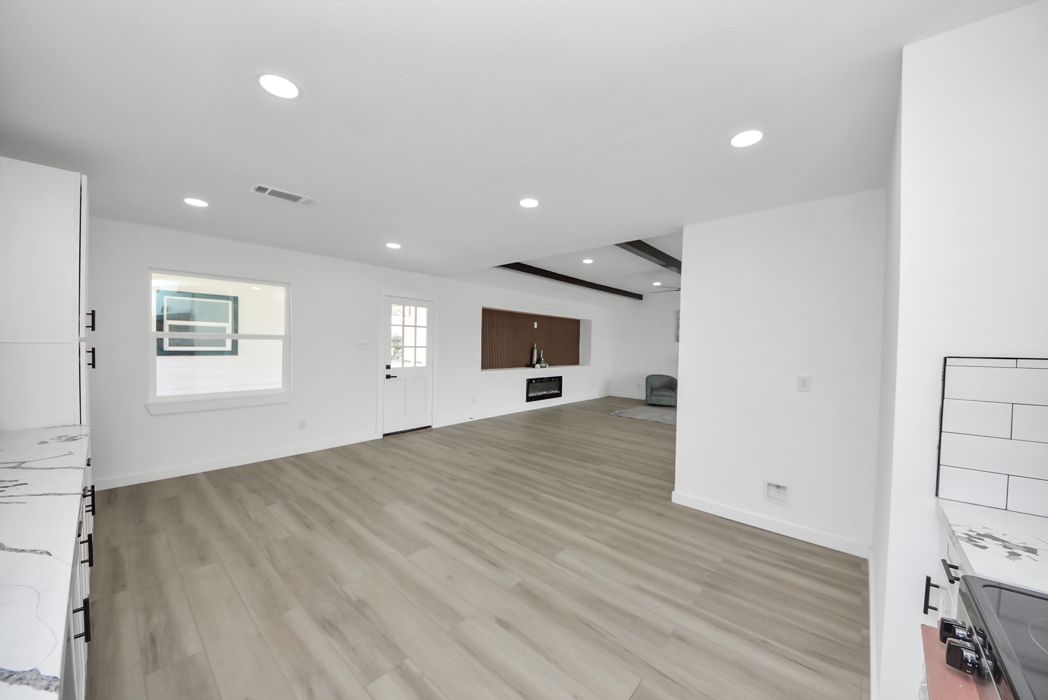 2701 Mustang Road Alvin, TX 77511 - Photo 15 of 45 a view of empty room with wooden floor and fan