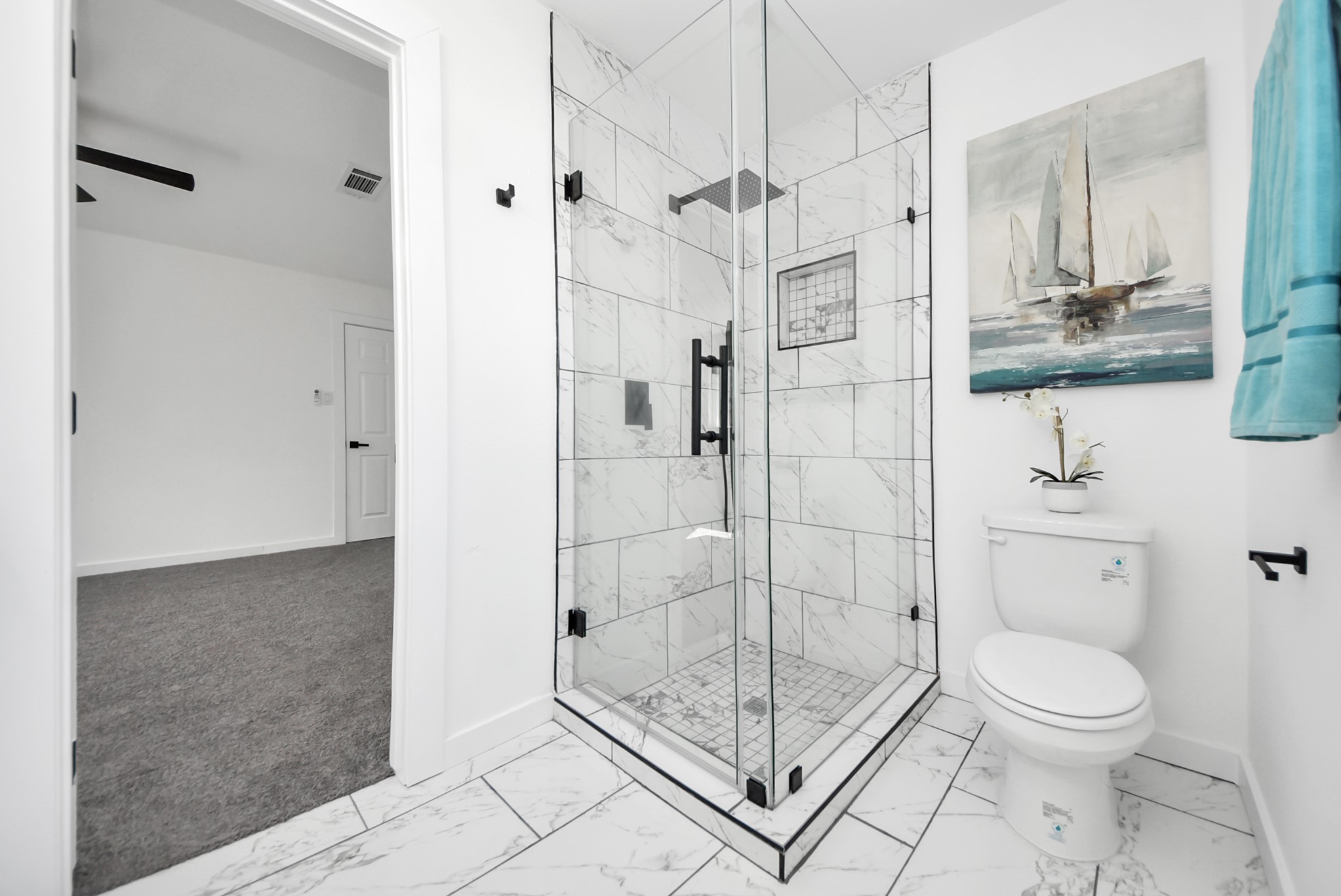 2701 Mustang Road Alvin, TX 77511 - Photo 20 of 45 a bathroom with a shower a toilet and a sink