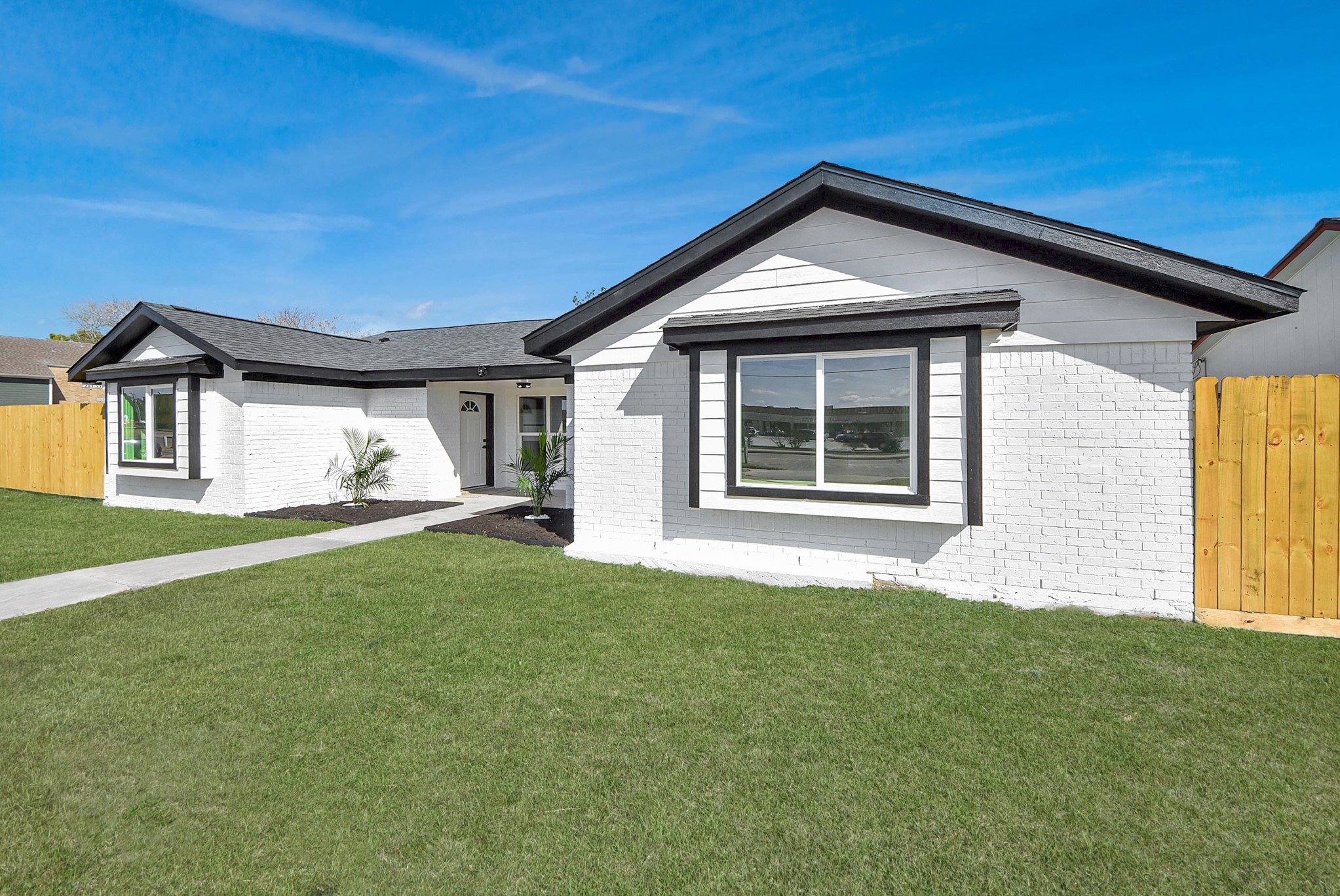 2701 Mustang Road Alvin, TX 77511 - Photo 2 of 45 a front view of a house with a yard