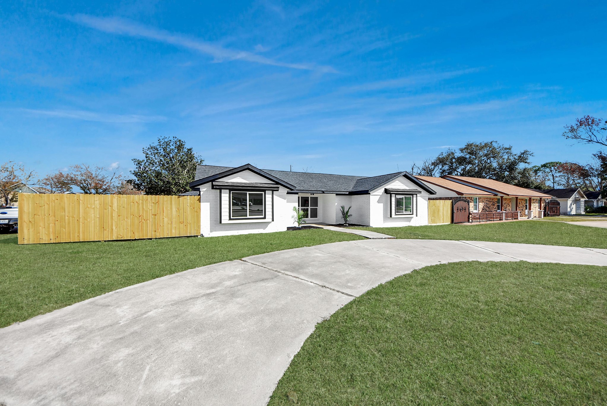 2701 Mustang Road Alvin, TX 77511 - Photo 38 of 45 a front view of a house with a yard and garage