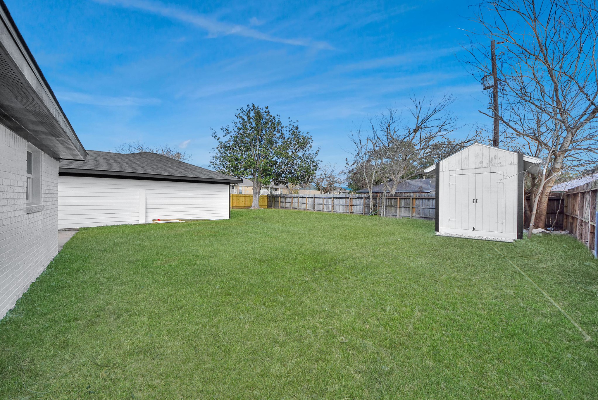 2701 Mustang Road Alvin, TX 77511 - Photo 40 of 45 a view of a backyard with a garden