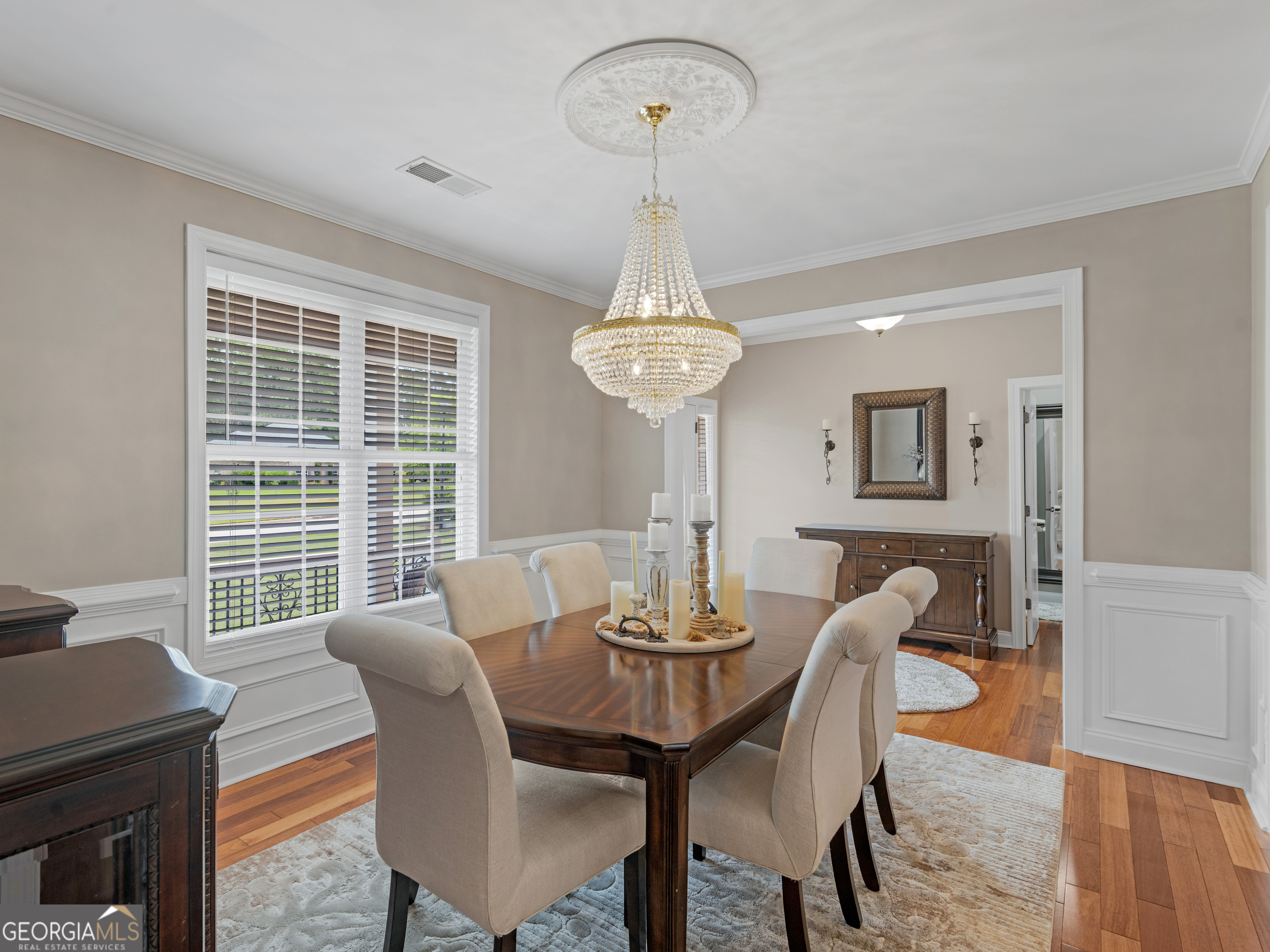 221 Hummingbird Court Hampton, GA 30228 - Photo 13 of 77 a view of a dining room with furniture window and wooden floor