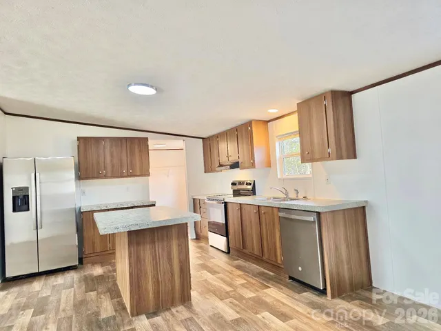 a kitchen with cabinets and window