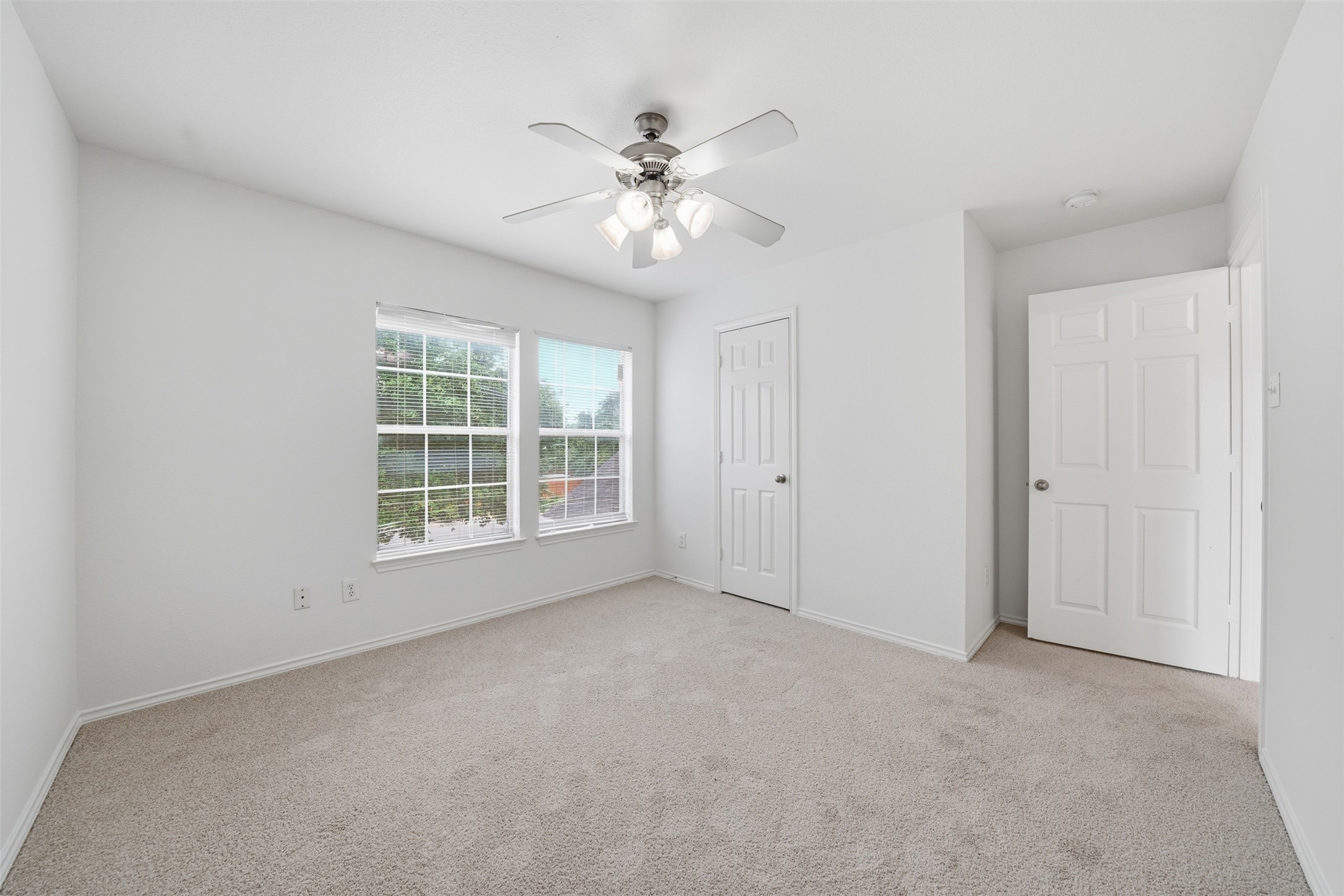 118 Invierno Street Kyle, TX 78640 - Photo 20 of 37 A quiet retreat with plush carpeting and abundant natural light flowing through generous windows.