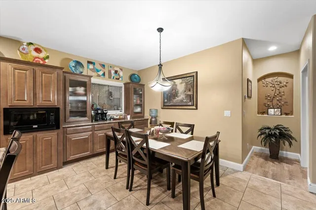 a bedroom with a bed couches and a couch