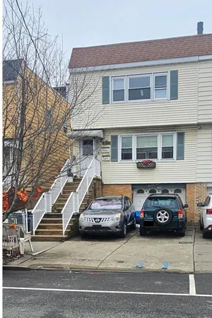 a large kitchen with granite countertop a sink stainless steel appliances and cabinets