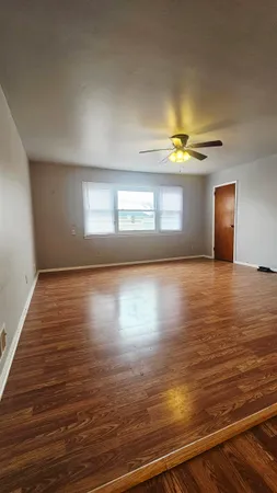 an empty room with a empty space and a window