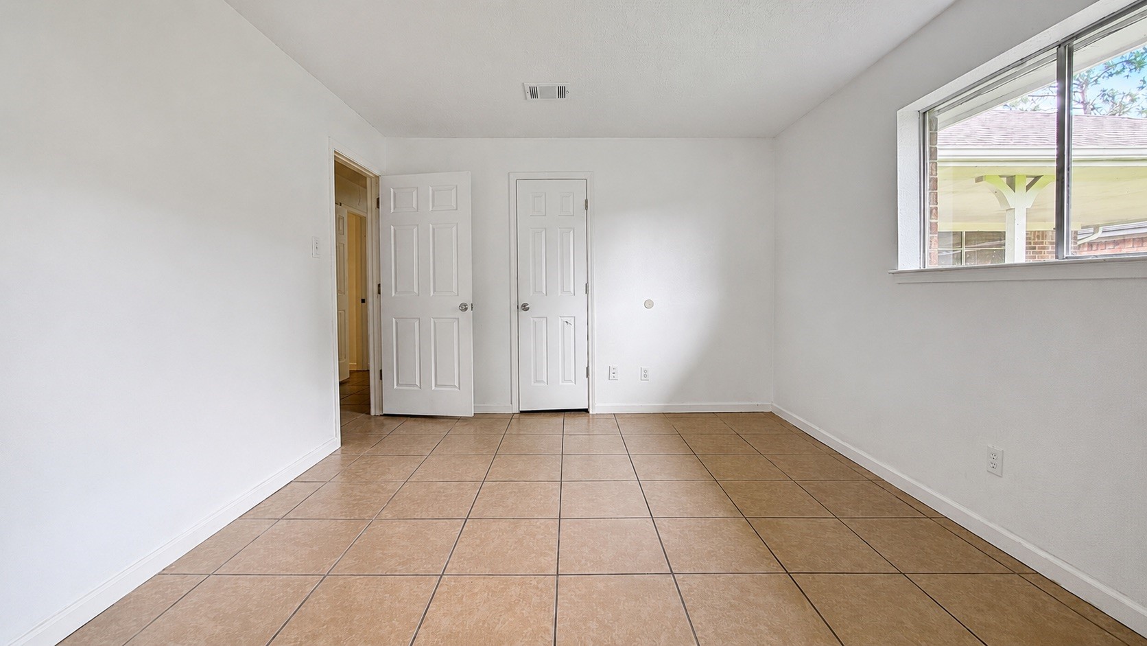 4418 Ponca Street Pasadena, TX 77504 - Photo 19 of 23 Additional flexible room space with tile flooring and natural light. (image has been enhance for marketing purposes)