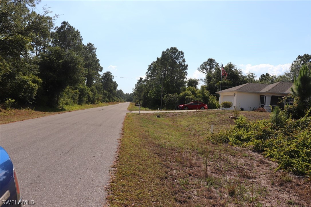 4244 East 24th Street Alva, FL 33920 - Photo 12 of 13 a view of a house with a yard