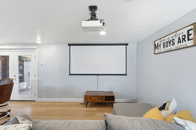 2500 North Fort Lane, Unit 220 Layton, UT 84041 - Photo 7 of 23 Entertainment space featuring a ceiling-mounted projector, a retractable screen, and recessed lighting
