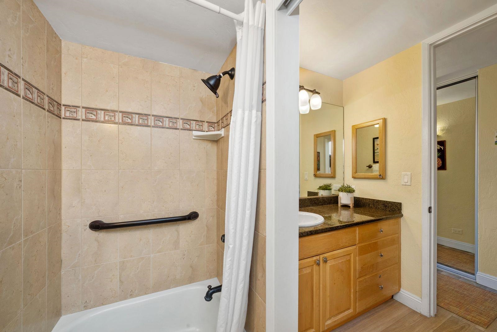 3543 Lower Honoapiilani Road, Unit J401 Lahaina, HI 96761 - Photo 12 of 25 a bathroom with a granite countertop sink mirror and shower