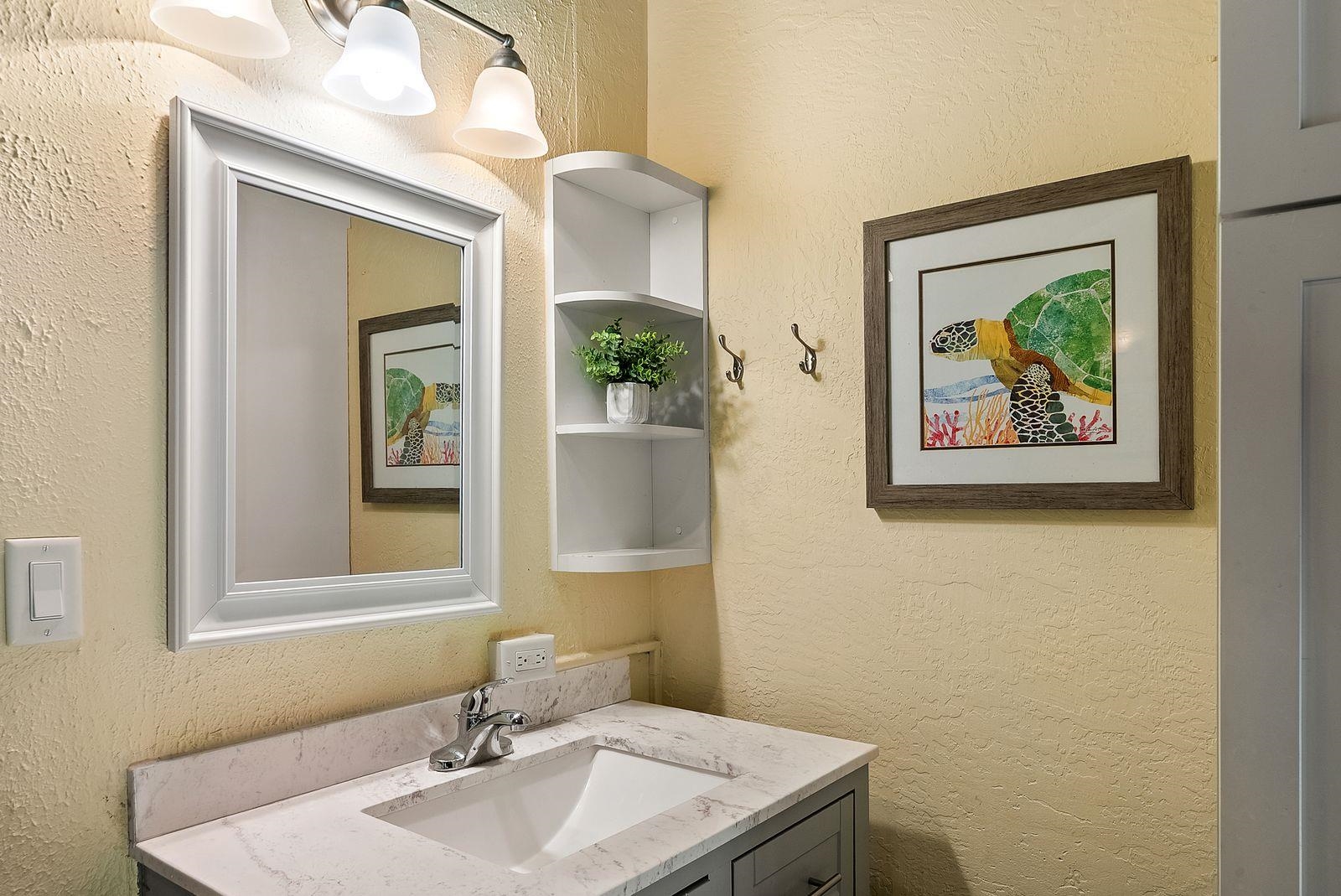 3543 Lower Honoapiilani Road, Unit J401 Lahaina, HI 96761 - Photo 15 of 25 a bathroom with a sink and a mirror