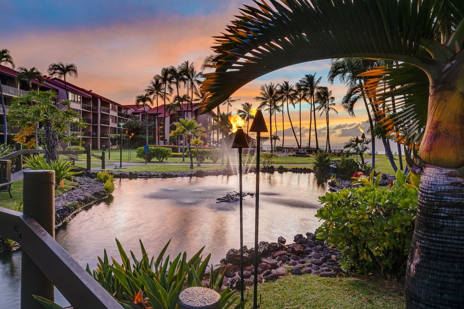 3543 Lower Honoapiilani Road, Unit J401 Lahaina, HI 96761 - Photo 22 of 25 a view of a street with a bench in front of it