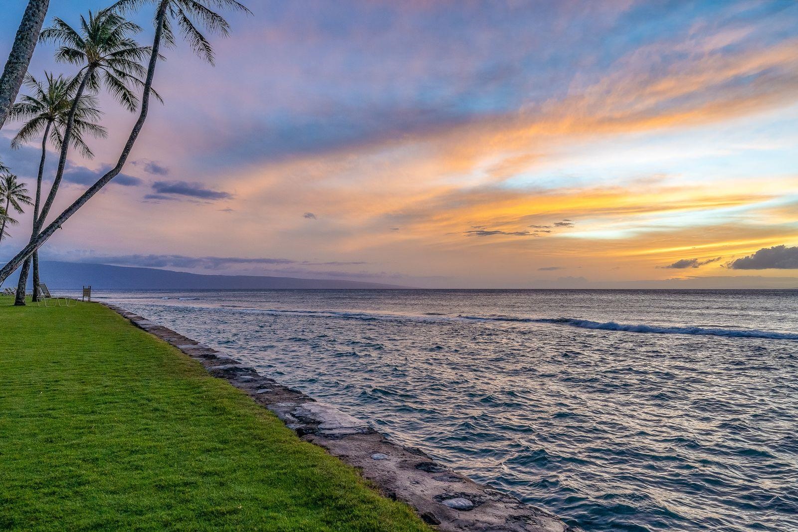 3543 Lower Honoapiilani Road, Unit J401 Lahaina, HI 96761 - Photo 25 of 25 a view of an ocean beach and mountain in the back