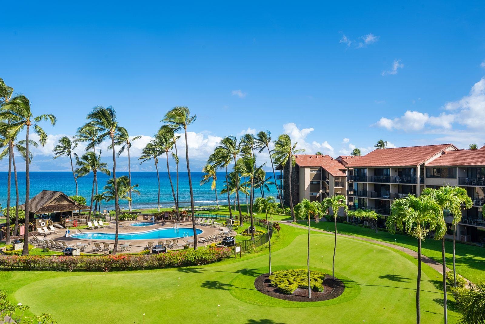 3543 Lower Honoapiilani Road, Unit J401 Lahaina, HI 96761 - Photo 3 of 25 a view of a house with a yard and potted plants