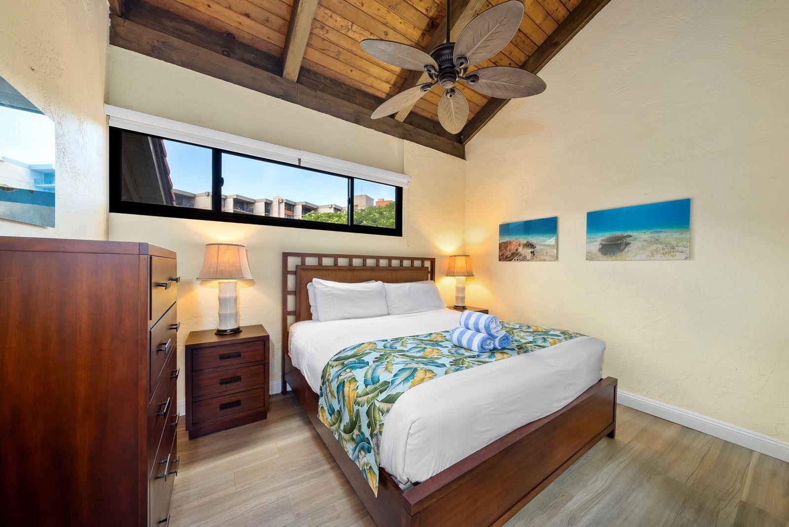 3543 Lower Honoapiilani Road, Unit J401 Lahaina, HI 96761 - Photo 9 of 25 a bedroom with a bed next to a window