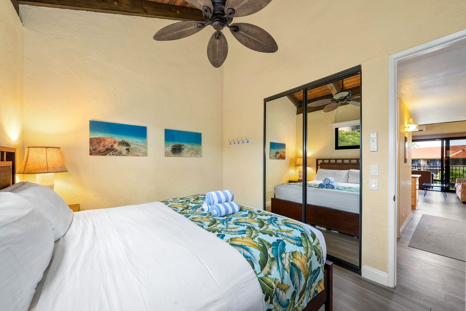 3543 Lower Honoapiilani Road, Unit J401 Lahaina, HI 96761 - Photo 10 of 25 a bedroom with a bed and wooden floor