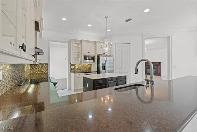 a bathroom with a tub a sink and mirror