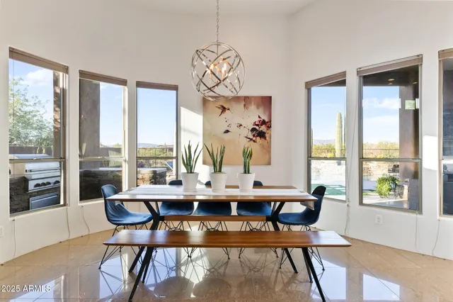 a view of a house with swimming pool and sitting area